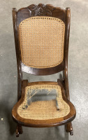 (1) SMALL WOODEN ROCKING CHAIR WIRH CARVED FLORAL DESIGNS