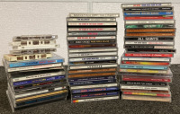 BOX OF CDS INCLUDING QUEEN, SHANIA TWAIN, THE CLASH, JOHN DENVER, TIM MCGRAW, YOUNG GUNS, GUNS N’ ROSES AND MORE