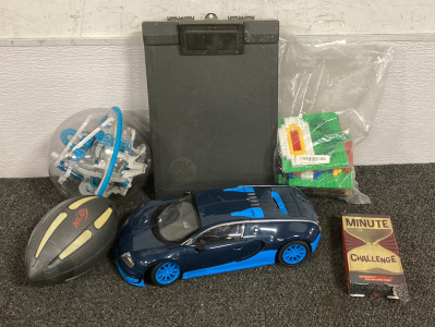 (1) &ldquo;MINUTE CHALLENGE&rdquo; GAME, (1) ELECTRIC CAR TOY (UNABLE TO TEST), (1) BAG OF LEGO BUILDING PIECES, (1) NERF FOOTBALL, AND MORE