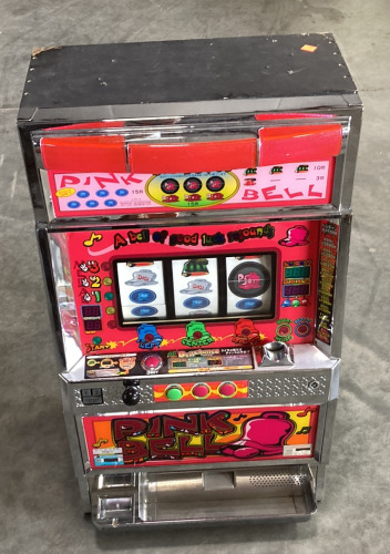 (1) PINK BELL SLOT MACHINE (POWERS ON) (32.5”X13.5”)