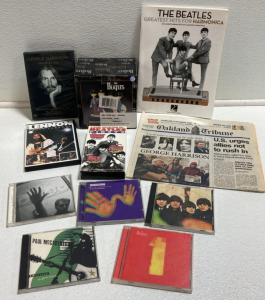 The Beatles Memorabilia: Salt and Pepper Shakers, Harmonica Music Book, Harrison’s Death Newspaper, (5) CDs, (3) Movies