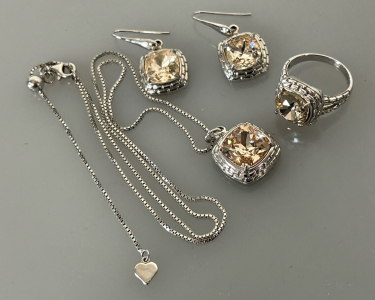 SILVER TONE MATCHING EARRINGS, NECKLACES AND RING (SIZE 7) WITH CHAMPAGNE CRYSTAL