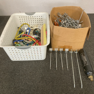 BOX OF SLAT WALL HANGERS, ASSORTED BUNGIE CORDS, WHITE BASKET, 12OZ CO2 TAKE (7/95) STAMP