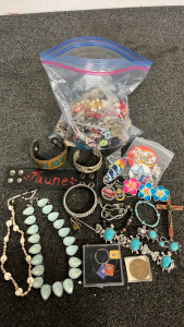 BAG OF COSTUME JEWELRY, KEY CHAINS, BRACELETS, PINS AND MORE