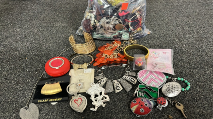 BAG OF COSTUME JEWELRY, KEY CHAINS, RINGS, AND MORE