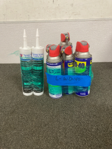 (6) CANS OF WD-40, (2) TUBES OF SILICONE ADHESIVE SEALANT