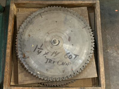 NUMEROUS SAW BLADES IN VARIOUS SIZES WITH PLYWOOD BETWEEN SOME (UNABLE TO GET PHOTOS OF BOTTOM LAYER OF BLADES)