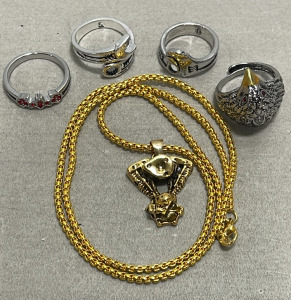 (1) Gold Toned Necklace, (4) Silver Toned Rings Sizes 10, 9-1/2, 7