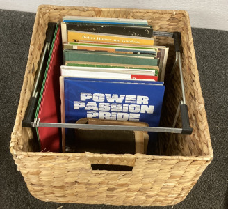 (1) WICKER BASKET FULL OF BOOKS INCLUDING, (1) 1926 EDITION NEW DICTIONARY OF THE ENGLISH LANGUAGE, (1) &ldquo;POWER PASSION PRIDE&rdquo; BOOK, AND MORE