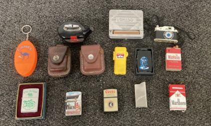 (1) VINTAGE METAL RIZLA CIGARETTE ROLLING TIN, (1) VINTAGE GOLF CLUB LIGHTER, (3) VINTAGE ZIPPO LIGHTERS, (2) ZIPPO CARRIERS, AND MORE