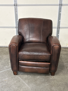 LEATHER RECLINER- ONE OF THE FEET NEEDS REATTACHED