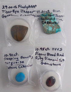 (1) 29ct Tiger Eye Jasper (1) 42.80ct. Blue Sea Sediment Jasper (1) 10.40ct. Sleeping Beauty Turquoise (1) 10.95ct. Pigeon Red Ruby