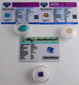 (3) Certified Natural Gemstones W/COA Including (1) 5.35ct Emerald Cut Purple Zircon (1) 6.60ct. Heliodor Buryl (1) 23.80ct Blue Pearcut Opal