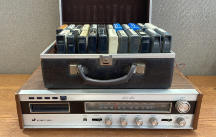 SOLID STATE VINTAGE AUTOMATIC RADIO WITH CASE OF 8 TRACK TAPES