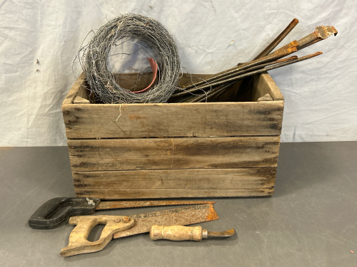 WOOD CRATE WITH ANTIQUE/VINTSGE HAND TOOLS, PICK AXE HEAD, BARBED WIRE AND MORE