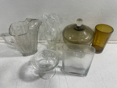 (1) Beautiful Glass Pitcher (2) Glass Candy Dishes (2) Glass Vases (1) Drinking Glass