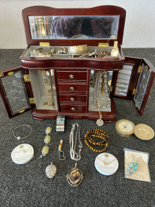 MAHOGANY FINISH JEWELRY BOX WITH VINTAGE R.C.M.P. TINY POCKET KNIFE, RINGS, NECKLACES, EARRINGS, BRACELETS AND MORE