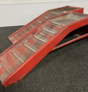 A PAIR OF RED CAR RAMPS