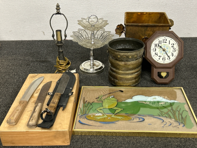 METAL PLANTERS, WALL CLOCK (MECHANISM NEEDS REPLACED), SMALL TABLE LAMP (UNABLE TO TEST, GLASS 2-TIERED SERVING DISH, KNIVES WITH WOODEN BOX AND FROG GOLFING PICTURE