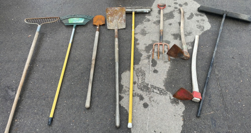 Assorted Yard Tools! (1) Garden Rake (2) Fire Mattocks (1) Pitch Fork (2) Assorted Shoves (1) Leave Rake (1) Black Push Broom