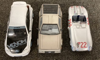 (1) Hot Wheels Ford Focus Die Cast, (1) 1981 De Lorean LK Die Cast, And (1) Mercedes-Benz 300 SLR Die Cast