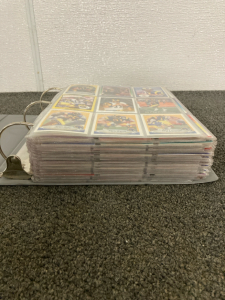 Binder Full of Football Cards- Including Joe Montana, Dan Marino, Barry Sanders, Troy Aikamn, Emmitt Smith and MORE!