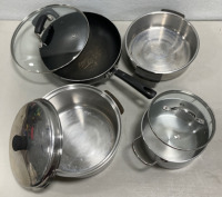 (1) Skillet with a Lid (1) Stainless Steel 3QT Pot with Lid (1) Stainless Steel Pot with Wooden Handles and a Lid (2) Metal Cupcake Baking Sheets (1) Sunflower Cake Pan (2) Bunt Cake Cake Pans and More… - 2