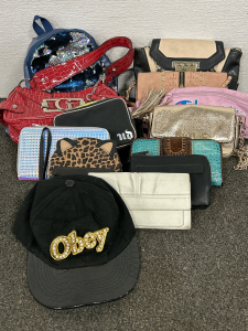 Various Purses and Wallets with an “Obey” Rhinestone/Gold on Black Hat