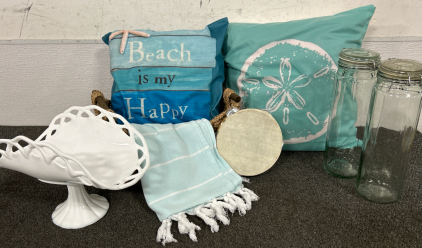 Beach Themed Accent Pillows (2) Translucent Blue Tall Jars (2) Pale Blue/White Accent Blanket (1) Vintage Milk Glass Fruit Bowl on Pedestal (1) Wicker Basket (1) And Tambourine