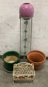 (1) Large Green Ceramic Planter Pot (13.5”X11”), (1) Ceramic Earth Toned Planter Pot (13.5”X12”), (1) Small Pink Planter Pot (8”X9”), (1) Metal Plant Holder (40.5”X8”), And (1) Decorative Metal Basket Plant Holder