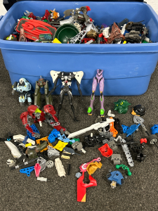 Small Tote With A Variety Of Parts And Pieces To Build your Own Action Figures And Anything You Choose To Create