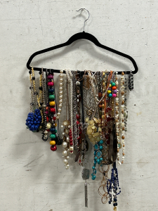 Variety Of Fashion Jewelry Displayed On Velour Hanger