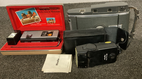 Canon 110ED20 Camera, Minolta Auto 32, and Model 160 Polaroid Land Camera