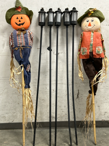 (5) Off Brand Tiki Torches & (2) Scarecrows