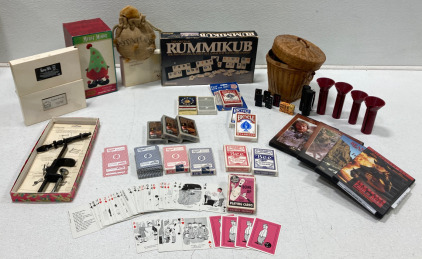 (1) Rummikub Game (1) Basket of Dominoes (14) Sets of Playing Cards & More…