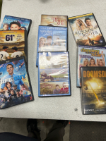(1)Tile Cutter (25) DVD Movies. (25) Metal Coat Rack. (1) Planter Bucket. (1) Military (1) Duffy bag Computer Bag. - 2
