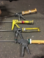 Box of Various Caulking Guns