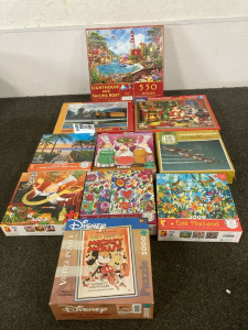 (10) Puzzles, Assorted Sizes And Pieces Including Lighthouse, Bon Appetit, Vintage Mickey And More- Piece Completion Unknown