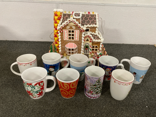 Lighted Gingerbread House With Santa; (9) Christmas Themed Coffee Cups