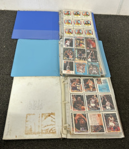 (3) Binders Full Of Approximately (300+) NBA And WCW Cards Including Players Such As Clyde Drexler, Manute Bol, Mark Price, Jimmy Oliver, Patrick Ewing, The Stinger, The Enforcer And More