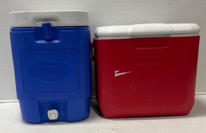 (1) Blue Coleman water Jug 5gal (1) red Coleman Cooler With Cup Holders