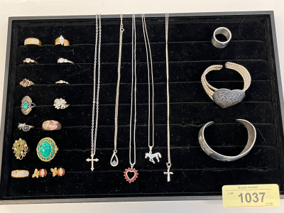 (14) Unique Rings (5) silver toned necklaces (2) Wrist Cuffs (1) Set of Clip on Earrings.