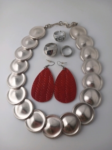 (1) Silver Tone Necklace (3) Rings (1) Pair of Red Leather Earrings