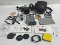 (1) Pentax ZX-50 With Original Box And Accessories