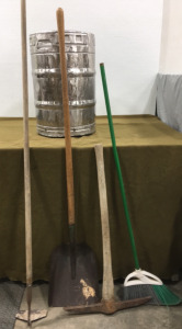 Empty Beer Keg, Pick, Hoe, Flat Headded Shovel & Broom