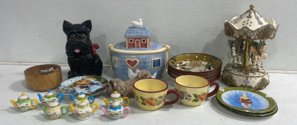 (1) Decorative Pegasus Carousel (2) Assorted Cookie Jars (7) Assorted Coffee Pot Trinkets And More!