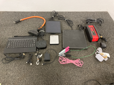 RCA Antenna Box, Roku 2 Box, Schumacher 12G Charger, My Passport Harddrive, Numberous Charging Cables Of Various Styles
