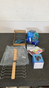 Brita filter, (two) note/journal books, cup holder with coin holder, (Two) closet organizers, stove top spoon rest (Microwave Safe)