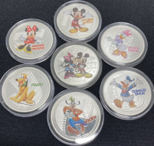 (7) Disney Character Silver Plated Collectible Coins