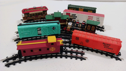 (8) Railroad Cars (8) Pieces of Railroad Tracks